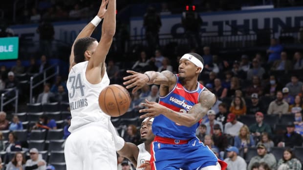 Nov 26, 2021; Oklahoma City, Oklahoma, USA; Washington Wizards guard Bradley Beal (3) passes the ball around Oklahoma City Thunder forward Kenrich Williams (34) during the second quarter at Paycom Center. Mandatory Credit: Alonzo Adams-USA TODAY Sports